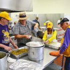 Members of the Lemoore Lions Club help prepare Thursday's Thanksgiving meal, a tradition that began 18 years ago and continues in 2018.